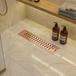 Load image into Gallery viewer, Rose gold wave pattern linear shower drain 12x4 inches with premium PVD coating and brushed matte finish